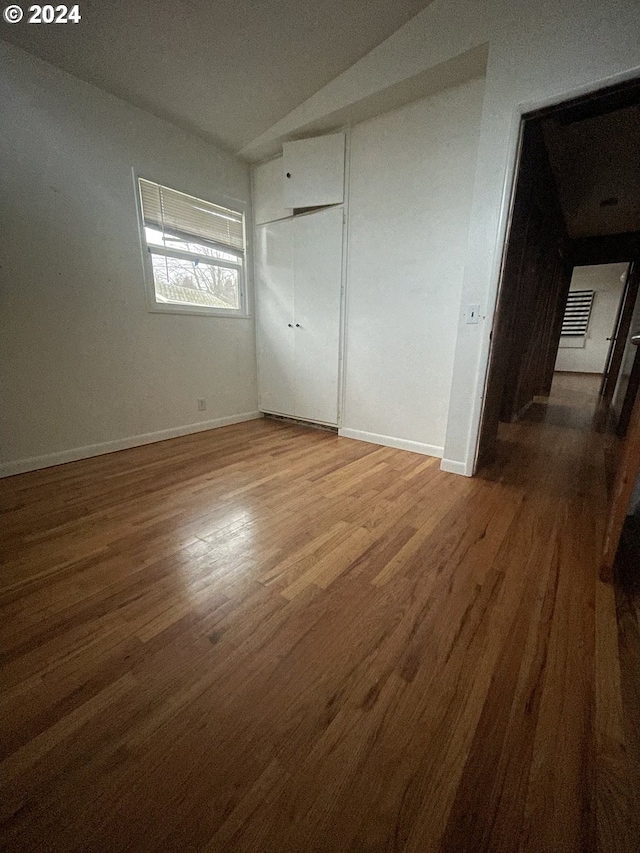13815 NE Knott St, Portland, OR 97230 - unfurnished bedroom featuring wood finished floors and a closet