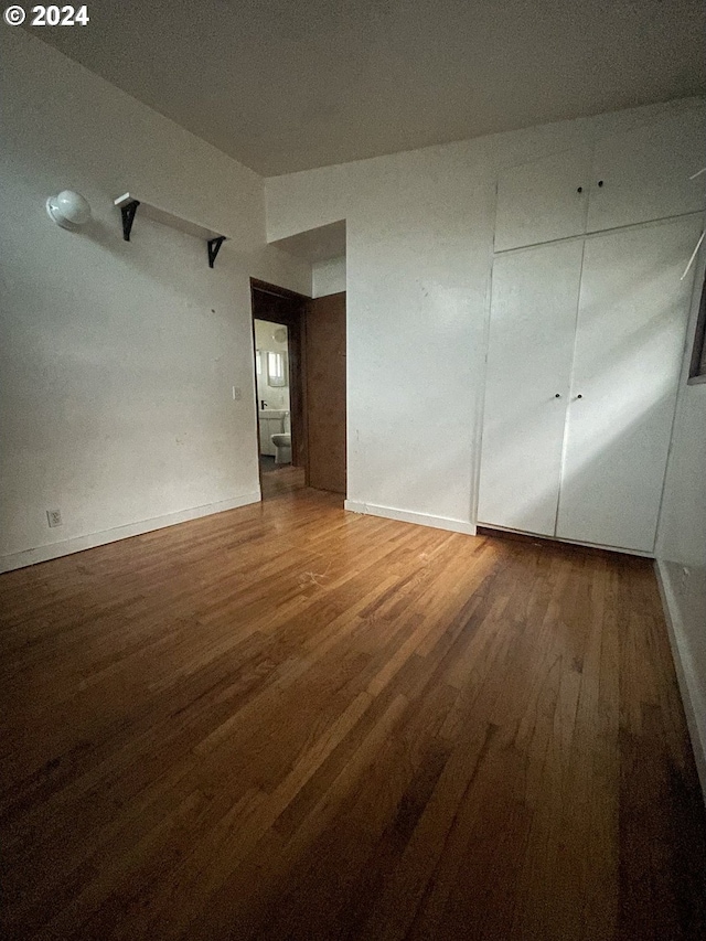 empty room featuring hardwood / wood-style flooring