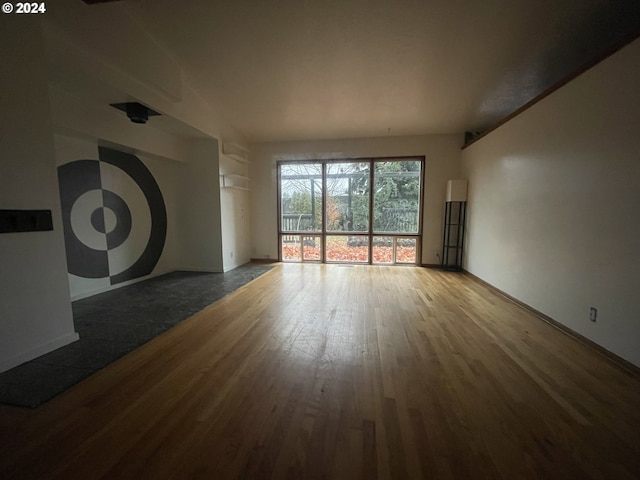 unfurnished living room with hardwood / wood-style floors