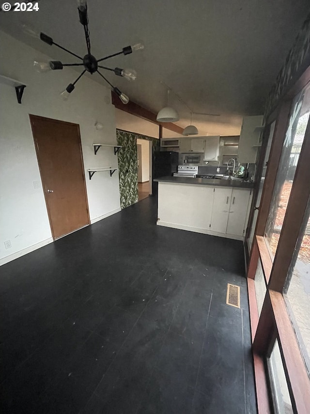 13815 NE Knott St, Portland, OR 97230 - unfurnished living room with a chandelier and baseboards