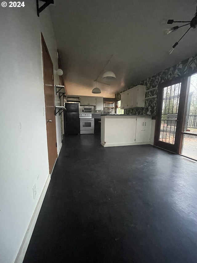 13815 NE Knott St, Portland, OR 97230 - kitchen featuring white electric range oven, freestanding refrigerator, concrete flooring, and wallpapered walls
