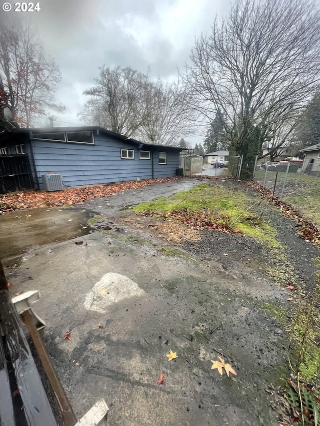 view of yard with central AC unit