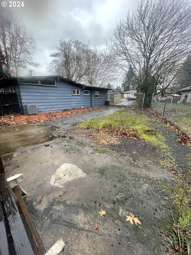 13815 NE Knott St, Portland, OR 97230 - view of side of home with a cooling unit