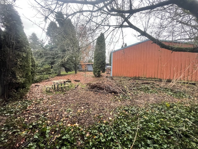 13815 NE Knott St, Portland, OR 97230 - view of yard with an outbuilding and an outdoor structure