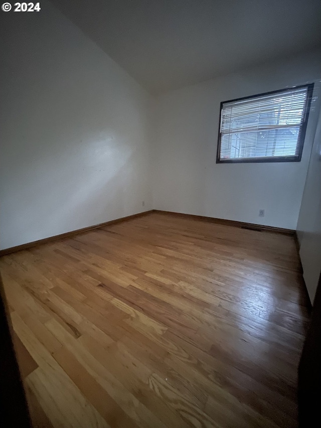 unfurnished room featuring light hardwood / wood-style flooring