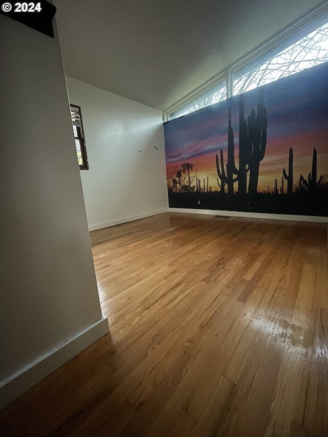 13815 NE Knott St, Portland, OR 97230 - empty room featuring wood finished floors and lofted ceiling