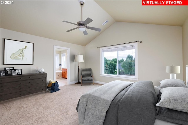 bedroom featuring ensuite bath, vaulted ceiling, ceiling fan, and carpet floors