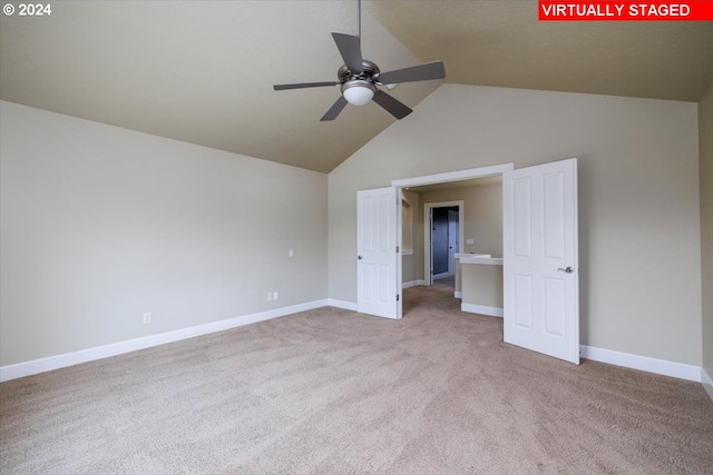 unfurnished bedroom with vaulted ceiling, ceiling fan, and carpet flooring