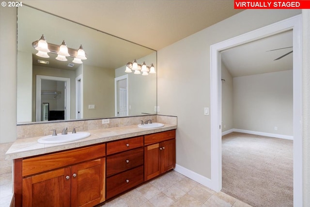 bathroom featuring ceiling fan and vanity