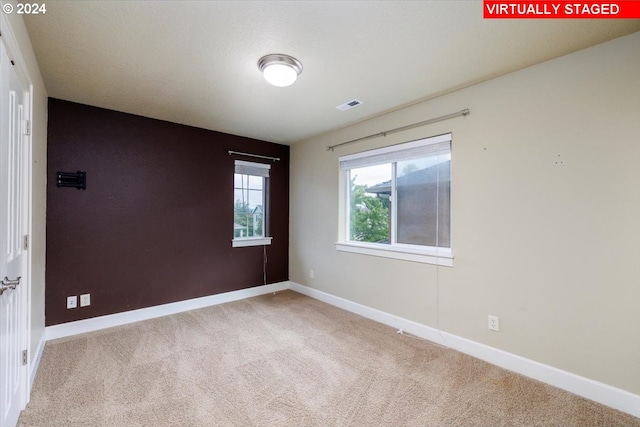 empty room with carpet flooring