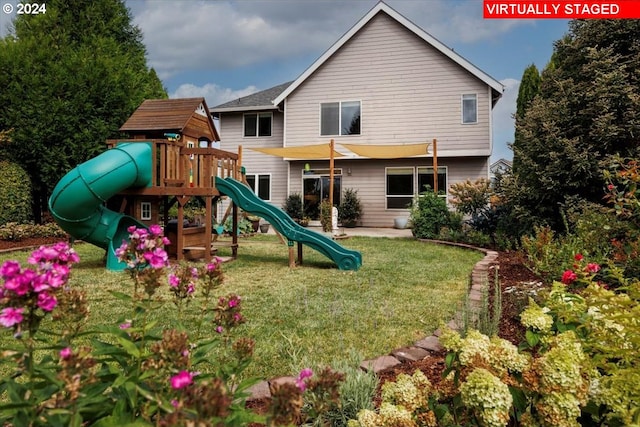 view of jungle gym featuring a lawn