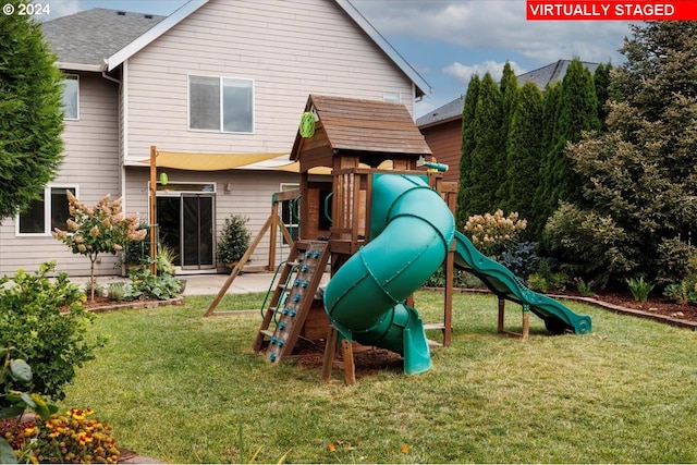 view of playground with a yard