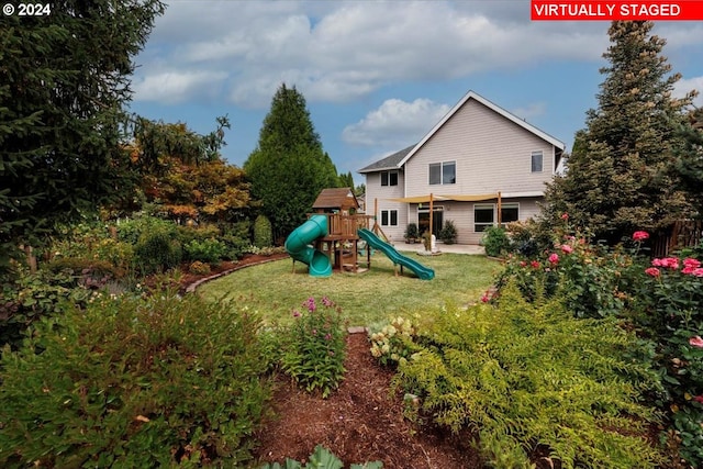 view of jungle gym with a yard