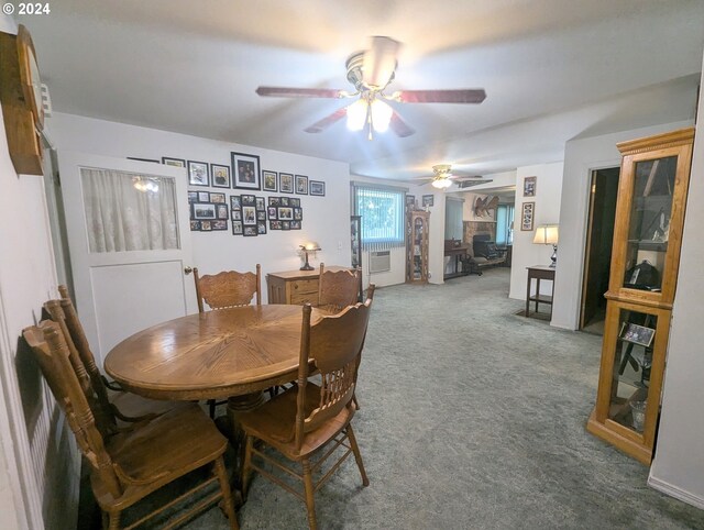 carpeted dining area featuring ceiling fan