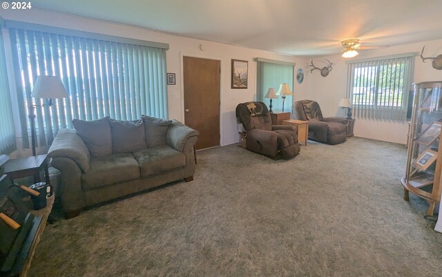 living room featuring carpet flooring and ceiling fan