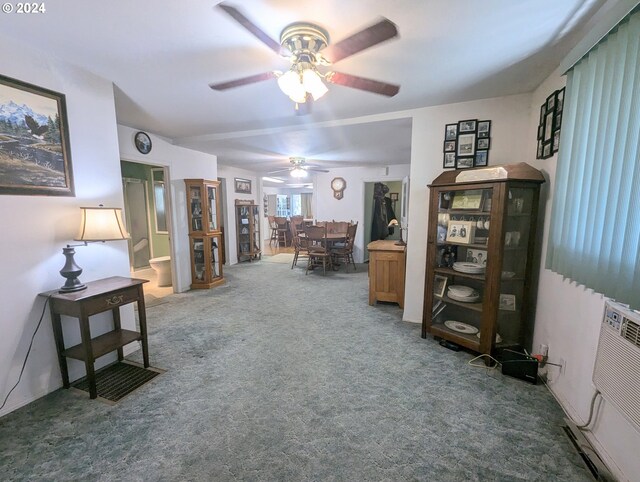 interior space featuring carpet and ceiling fan