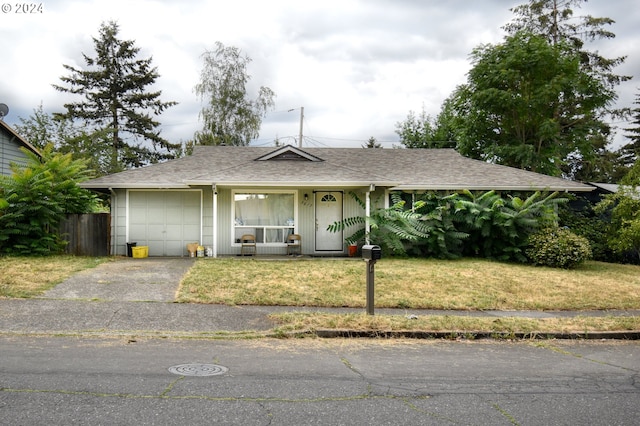 ranch-style house featuring covered porch and a front yard