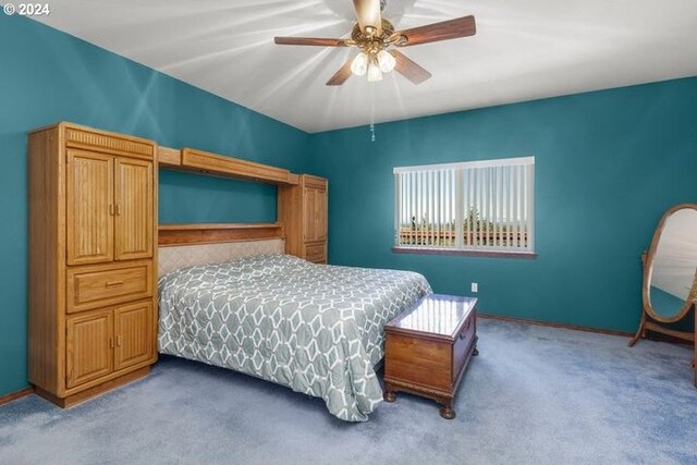 bedroom with light carpet and ceiling fan