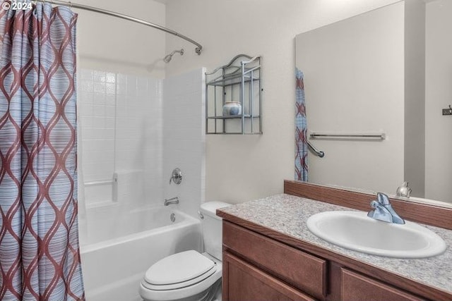 full bathroom with vanity, shower / bath combination with curtain, and toilet