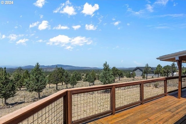 wooden deck with a rural view