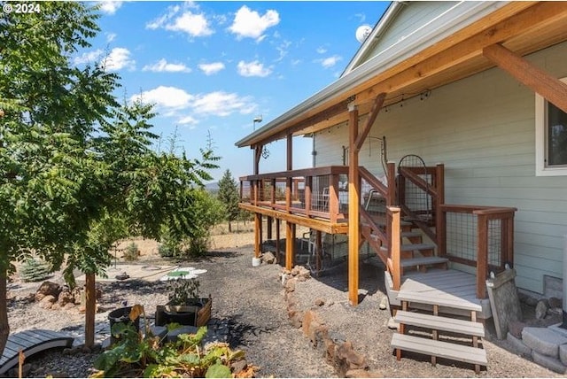 view of property exterior with a deck