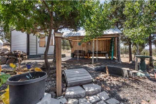 view of patio with an outbuilding