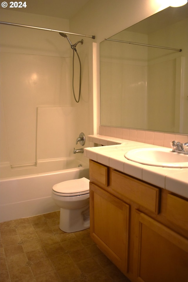 full bathroom with shower / bathing tub combination, vanity, and toilet