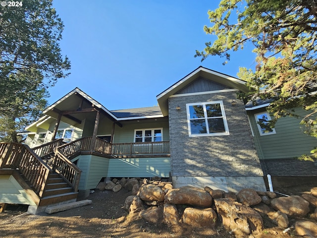 back of house featuring a deck