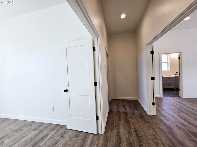 corridor featuring hardwood / wood-style floors