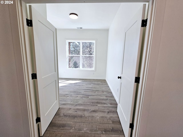 corridor featuring hardwood / wood-style flooring