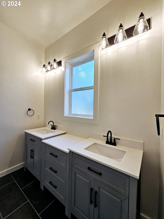 bathroom featuring double vanity and tile patterned flooring