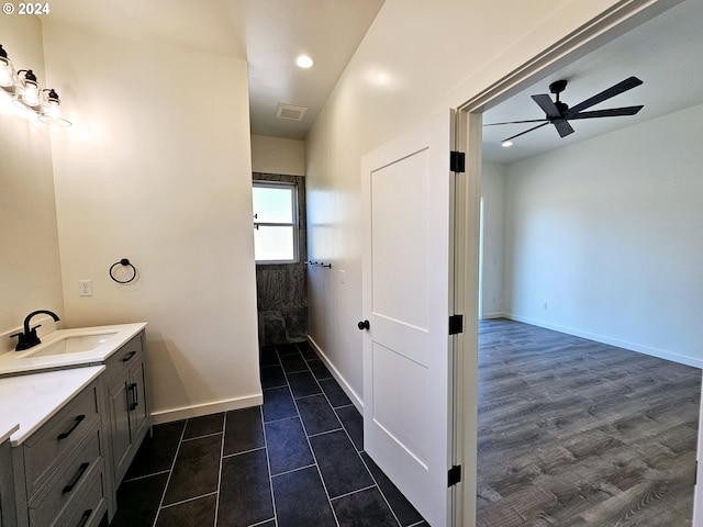 bathroom with vanity, ceiling fan, and hardwood / wood-style floors