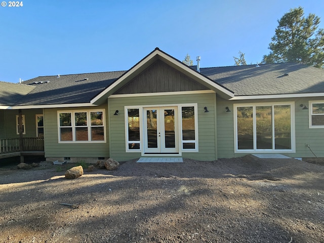 rear view of property with french doors