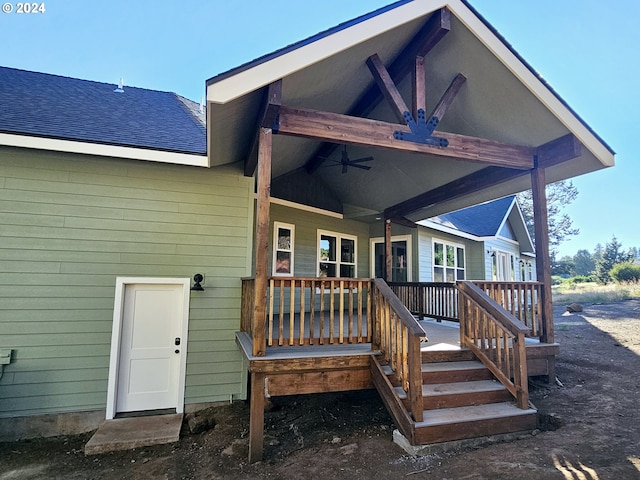 back of house with ceiling fan