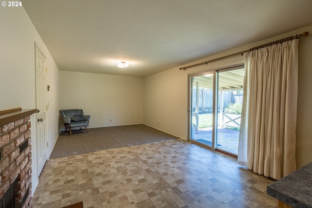 unfurnished living room with a stone fireplace