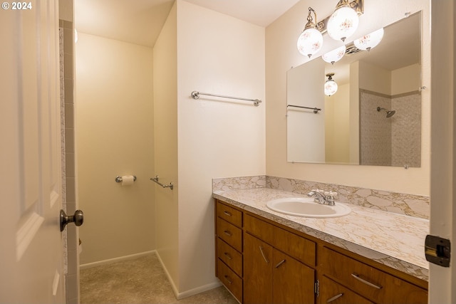 bathroom with a shower and vanity