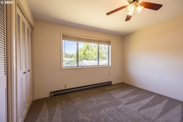 unfurnished bedroom with ceiling fan, carpet floors, baseboard heating, and a closet