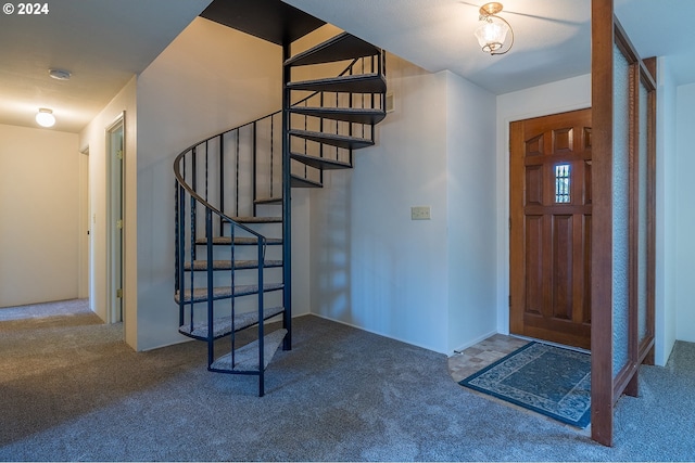 view of carpeted entrance foyer