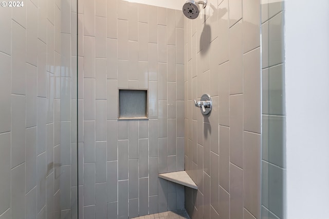 bathroom with tiled shower