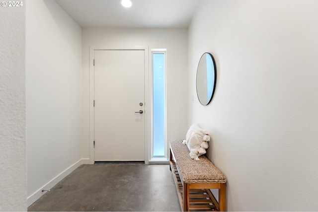 entrance foyer featuring concrete floors