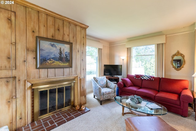 living room with crown molding, dark carpet, and a wealth of natural light