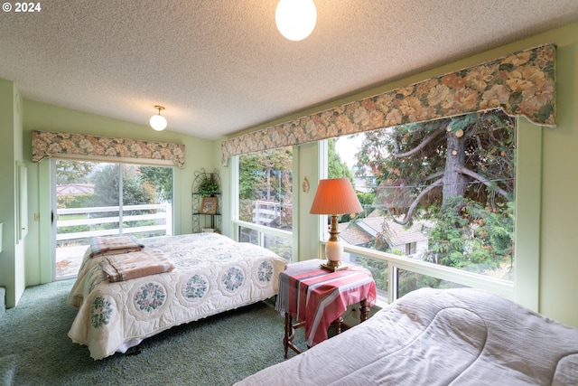 carpeted bedroom featuring a textured ceiling