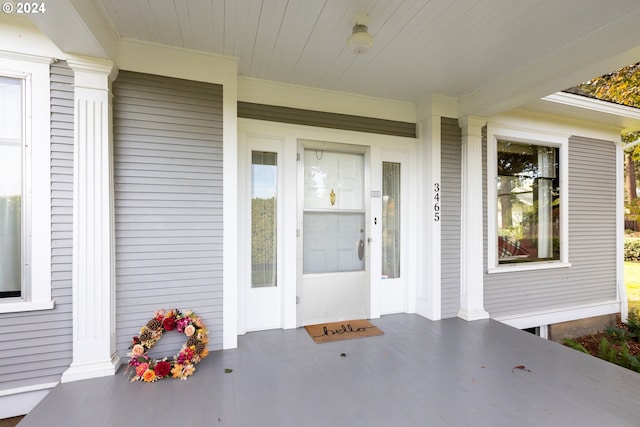 property entrance featuring covered porch