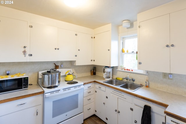 kitchen featuring white cabinetry, decorative backsplash, sink, and white range with electric cooktop