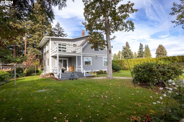 rear view of house with a lawn