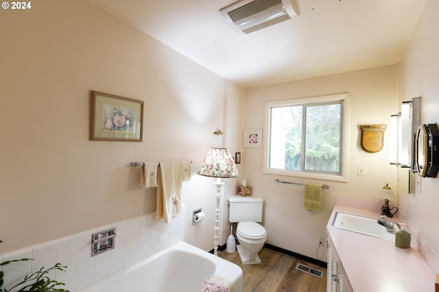 3465 Avalon Dr, Hood River, OR 97031 - bathroom with a bath, wood finished floors, visible vents, and toilet