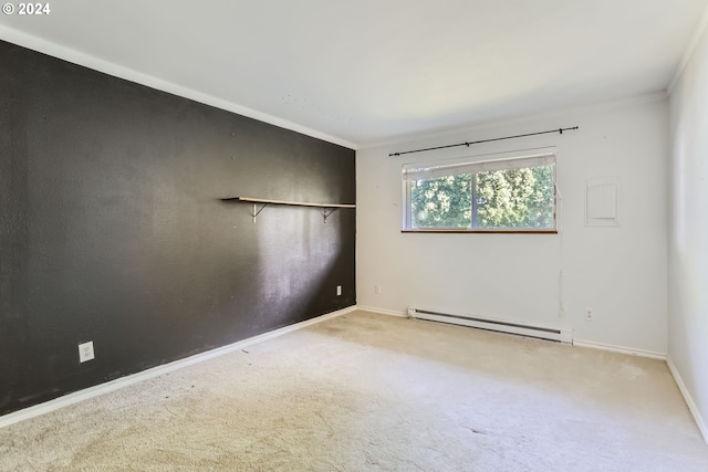 carpeted empty room with crown molding and a baseboard heating unit