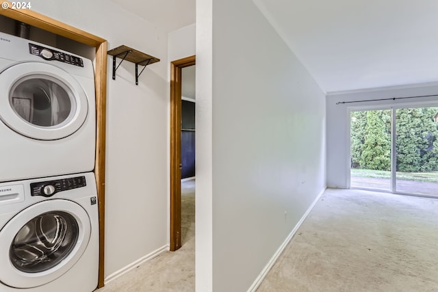 laundry room with stacked washer and clothes dryer and light carpet