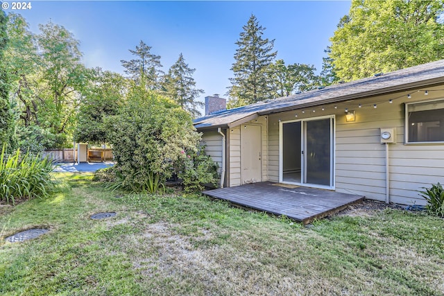 view of yard featuring a wooden deck