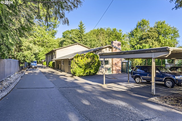 view of vehicle parking featuring a carport